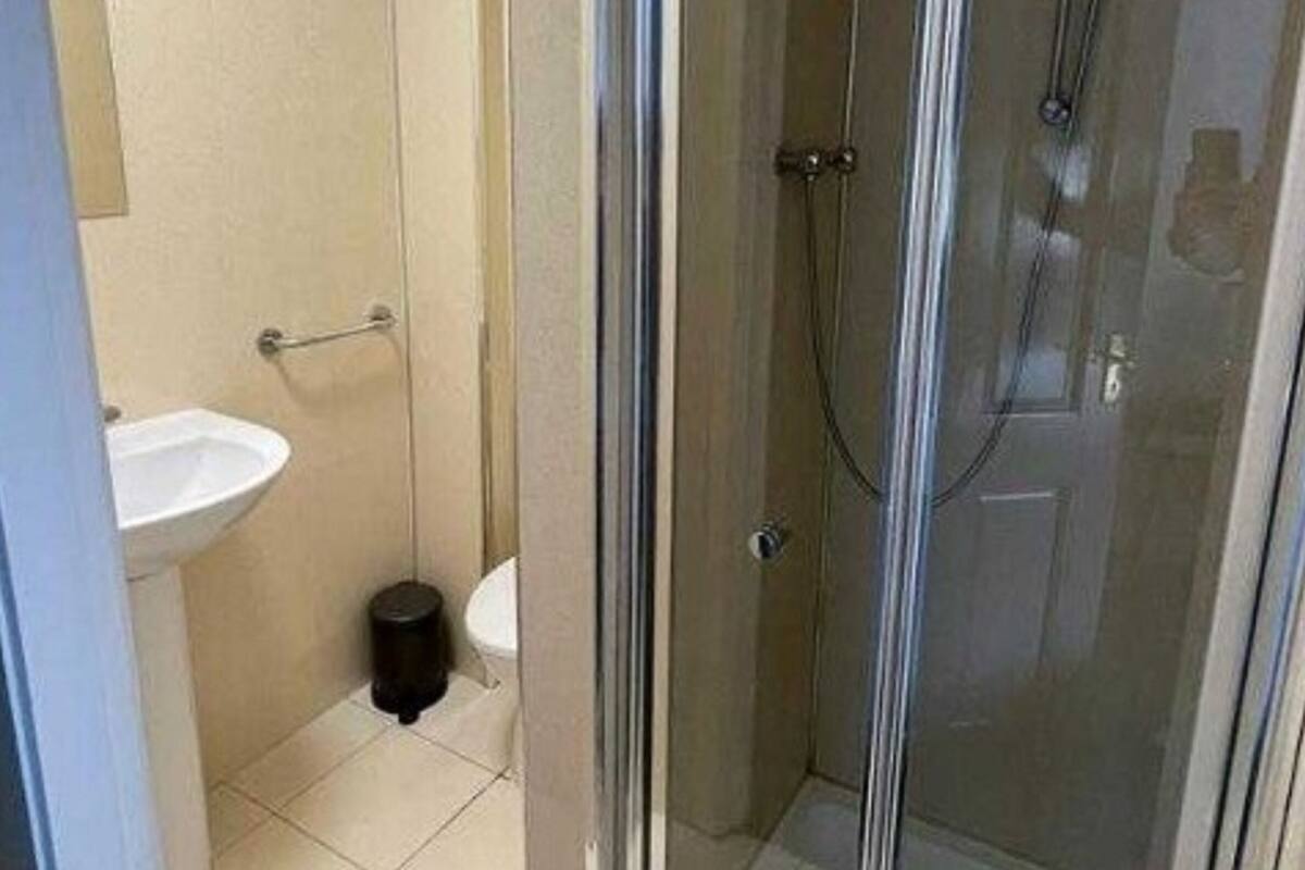 family room, multiple beds (family of 3) | bathroom | shower, free toiletries, towels, soap
