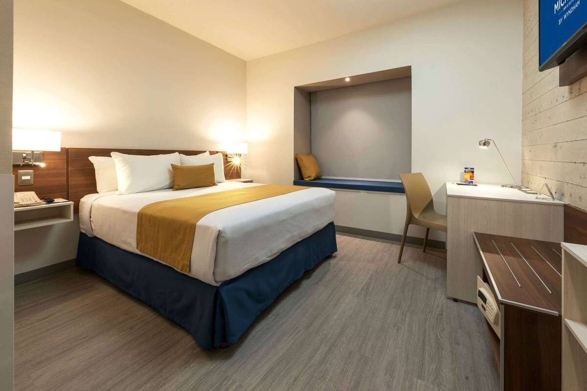 In-room safe, desk, blackout curtains, iron/ironing board (on request)