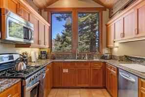 Fridge, microwave, oven, stovetop - Gull Lake Craftsman, a custom home that sleeps 10. (June Lake)