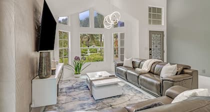 Stunning Naples home on 2 acres surrounded by beautiful palm trees and pool!