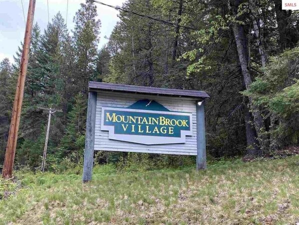 A sign for Mountain Brook Village. - Schweitzer Mountain Condo (Sandpoint)