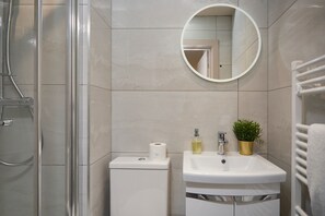 Shower, towels, soap, toilet paper