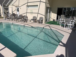 A heated pool, sun loungers