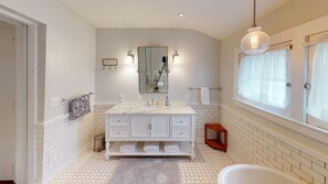 Bathtub, towels, toilet paper