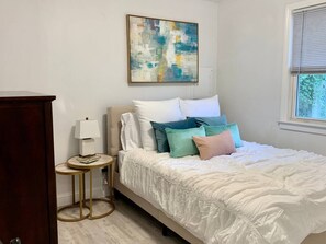 1 bedroom, desk, iron/ironing board, travel crib