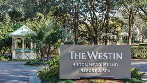 A sign for The Westin Hilton Head Island Resort & Spa, surrounded by lush greenery and a gazebo. - Beach Luxury Villa w/ Free Golf & Tennis plus Westin Resort Amenities! (Hilton Head Island)