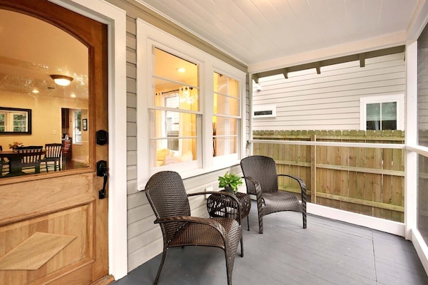 Screened front porch with view of historic Oak.