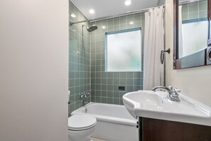 Combined shower/tub, hair dryer, towels, soap