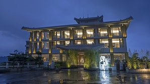 A traditional building with multiple floors, large windows, and a prominent entrance. - Hotel Day Plus Sun Moon Lake (Yuchi)