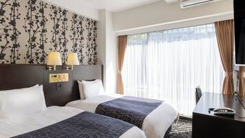 Twin Room, Non Smoking | Blackout drapes, free WiFi, bed sheets