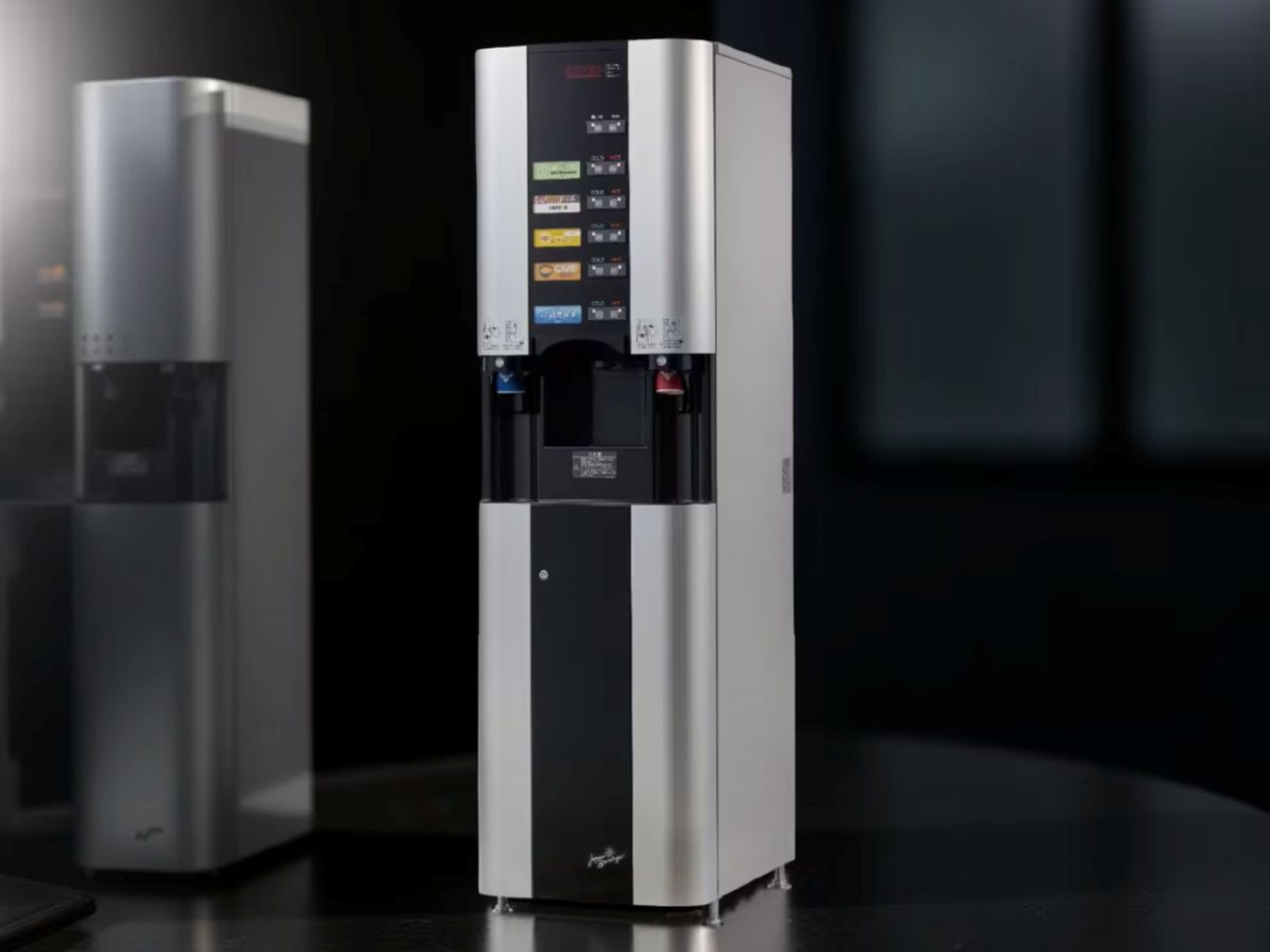 A modern, stainless steel water dispenser with a digital interface and multiple beverage options.