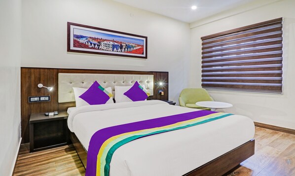Desk, iron/ironing board, bed sheets