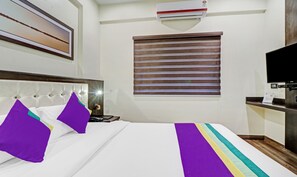 Desk, iron/ironing board, bed sheets