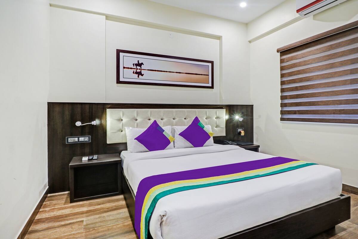Desk, iron/ironing board, bed sheets