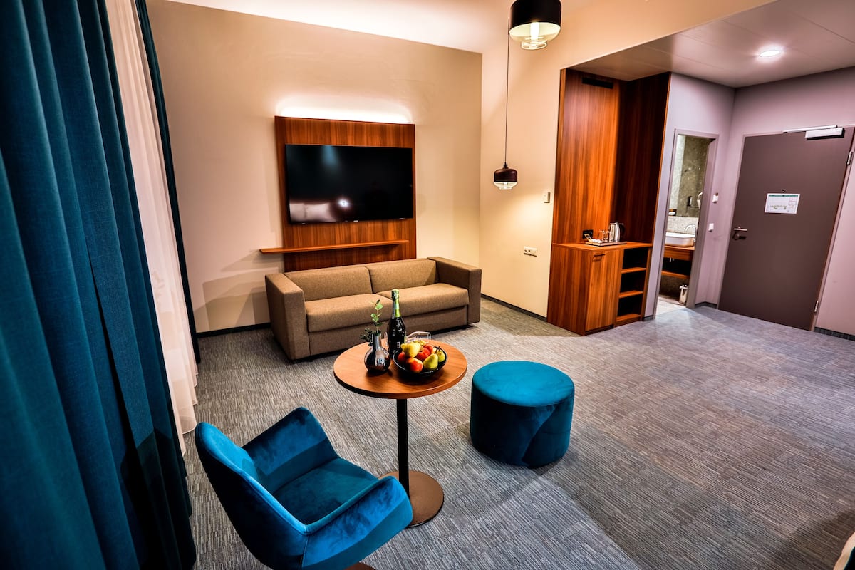 junior suite | 1 bedroom, in-room safe, desk, blackout curtains