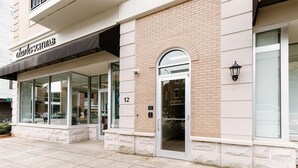 A building with a storefront named 'charleschwab'. - Overlook Downtown GVL! (Greenville)