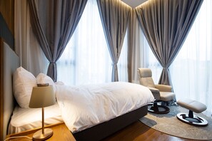 Suite (Twin) | Caja fuerte, decoración individual, mobiliario individual y ropa de cama