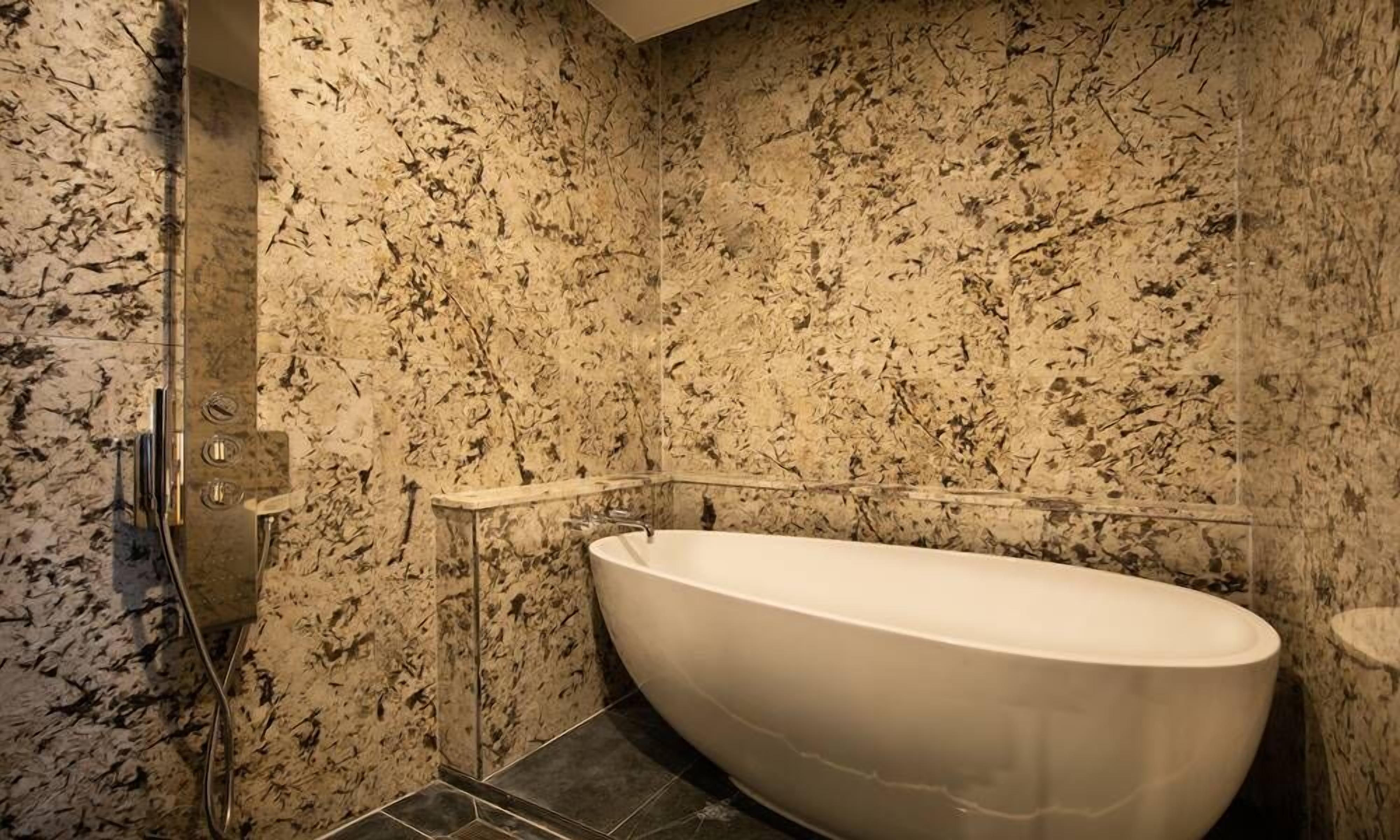 deluxe suite | bathroom | hair dryer, bathrobes, slippers, towels