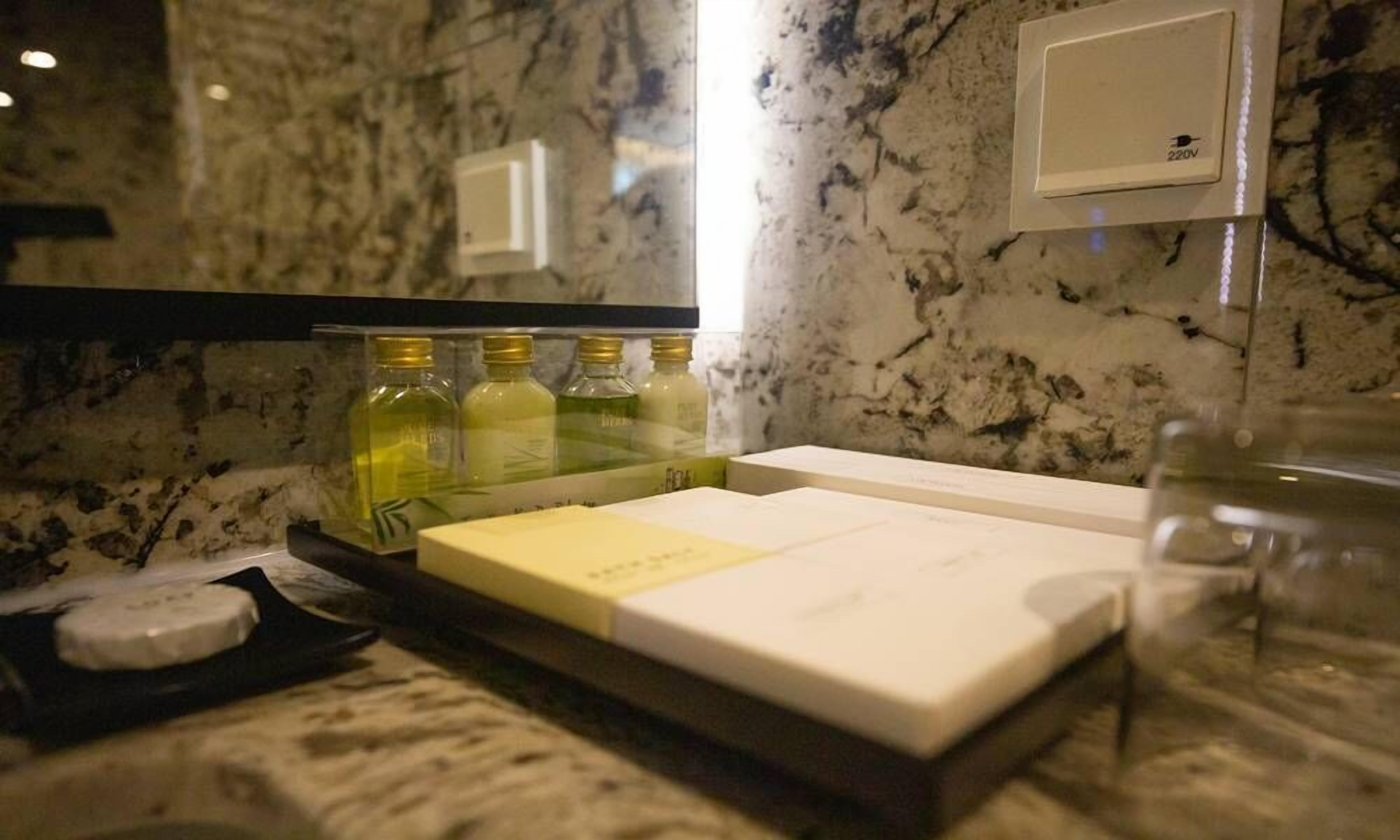 hair dryer, bathrobes, slippers, towels