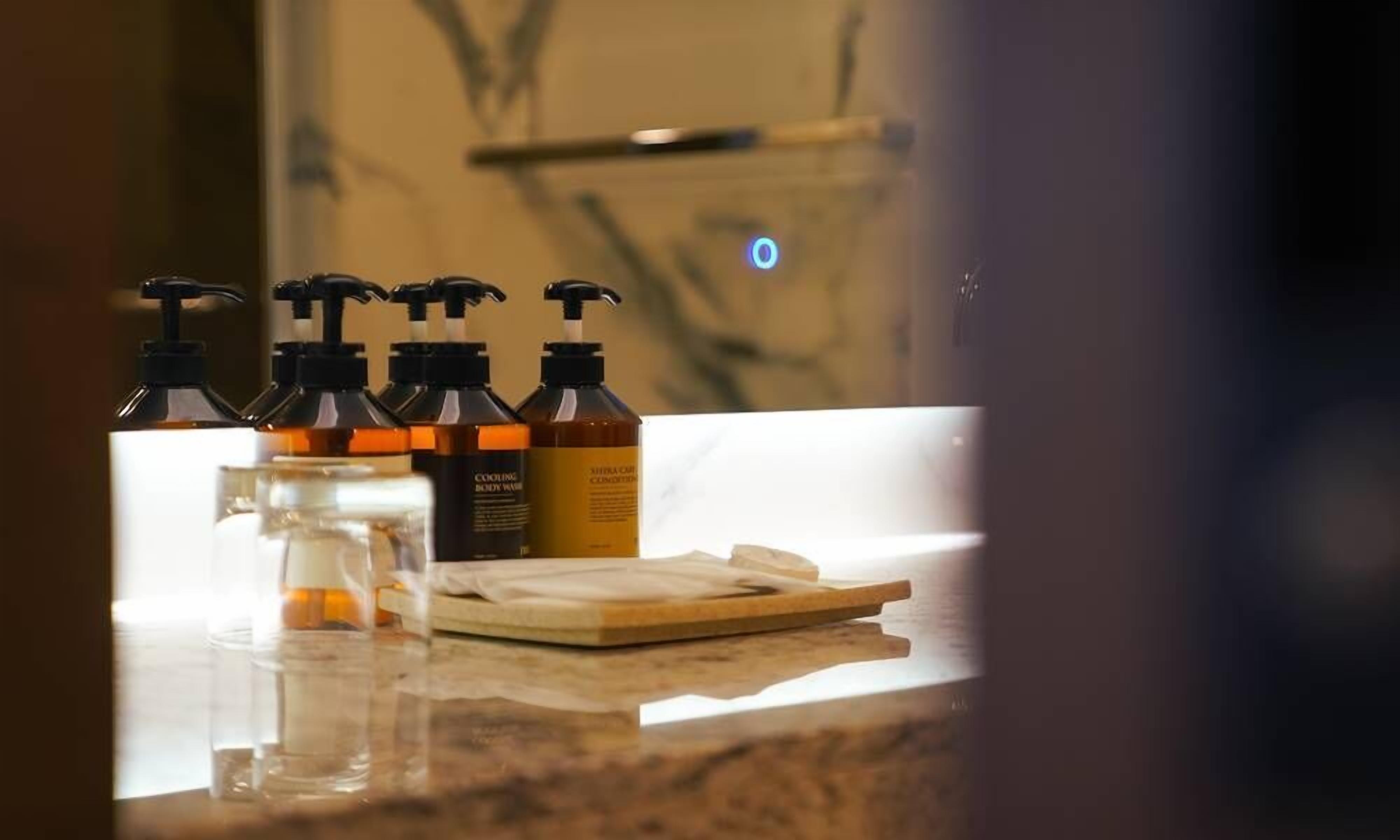 hair dryer, bathrobes, slippers, towels