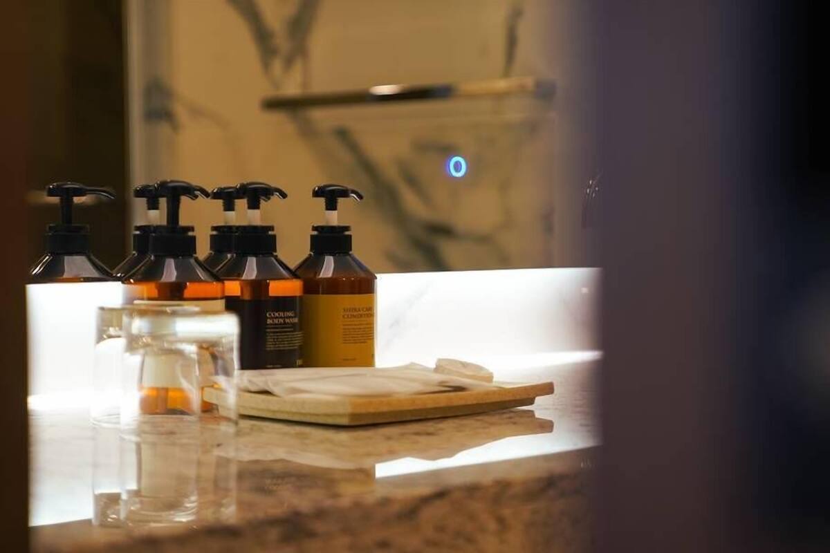 hair dryer, bathrobes, slippers, towels