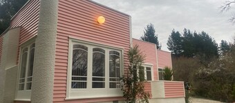 The chic, pink house on the Alpine Pacific Leader Road.