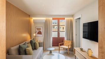 Apartment, 1 Bedroom | Living area | 37-inch flat-screen TV with satellite channels