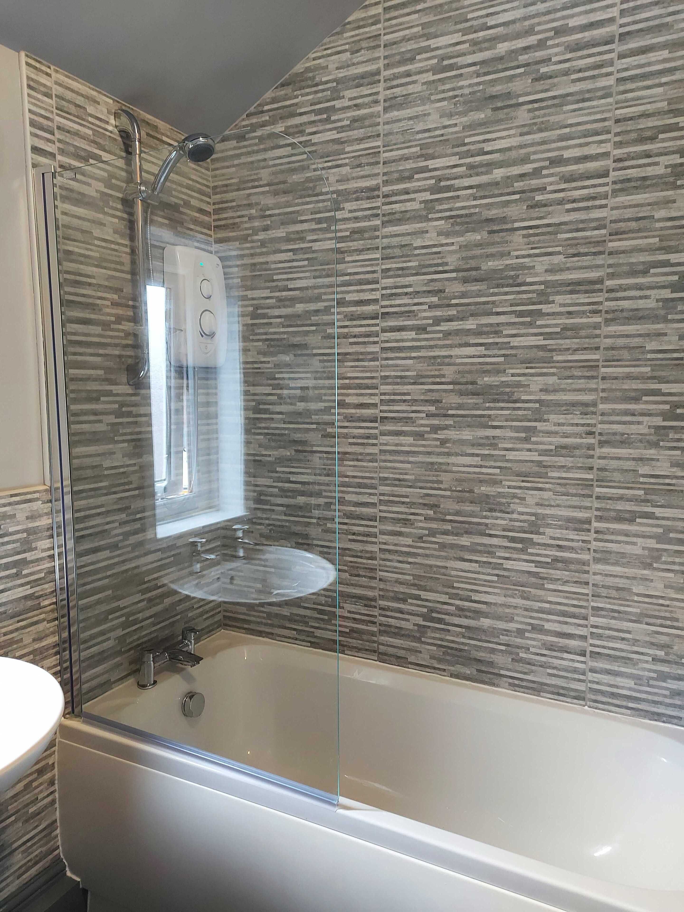 Combined shower/tub, hair dryer, towels, soap