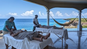 A massage therapy session on a terrace with ocean views. - Award-Winning Luxury Beach-Side Villa - Wrap-around Infinity Pool -Pickleball (Sabana Westpunt)