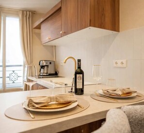 Fridge, microwave, stovetop, coffee/tea maker