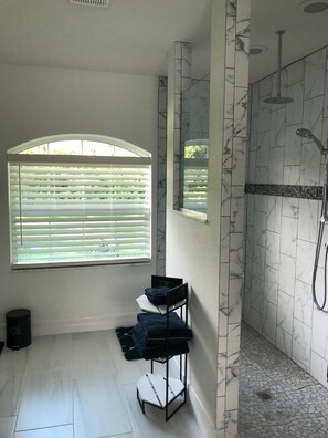 Shower, hair dryer, towels, soap