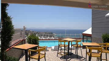 Seasonal outdoor pool, open 9:00 AM to 7:00 PM, free pool cabanas