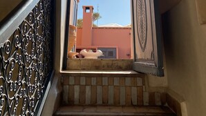 A staircase with ornate metal railings leading to an open doorway. - Riad Magellan with swimming pool & Jaccuzzi 2 steps from Jamaa el Fna square (Marrakech)