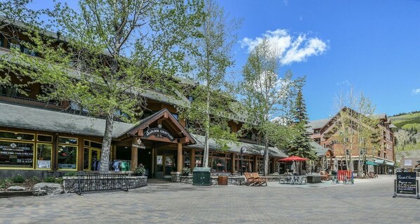 A rustic building with a sign reading "Grocery & Liquor" and a wooden exterior.