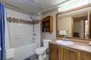 Combined shower/bathtub, hair dryer, towels, soap