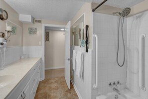 Bathtub, hair dryer, towels, soap