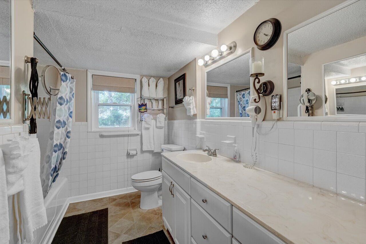 Bathtub, hair dryer, towels, soap