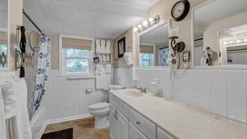 Bathtub, hair dryer, towels, soap