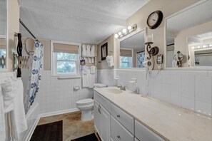 Bathtub, hair dryer, towels, soap