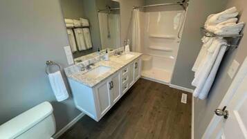 Combined shower/tub, hair dryer, towels, soap