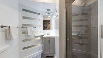 Bathtub, hair dryer, towels, soap