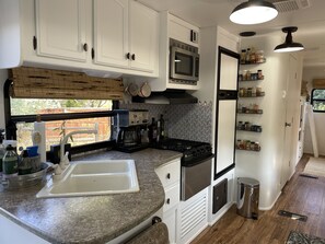 Microwave, coffee/tea maker, cookware/dishes/utensils