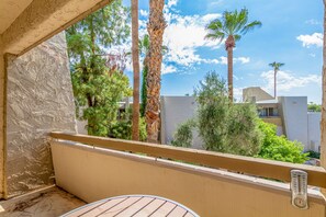 Enjoy the serene view of the surrounding residential area from this balcony.