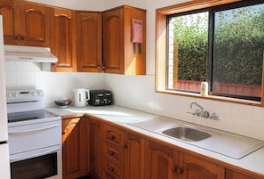 Coffee/tea maker, fridge, microwave, oven