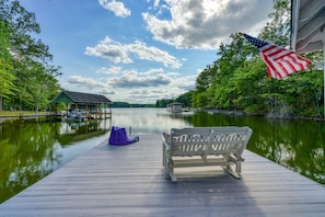 Sit on the dock and enjoy the serene lakeside view.