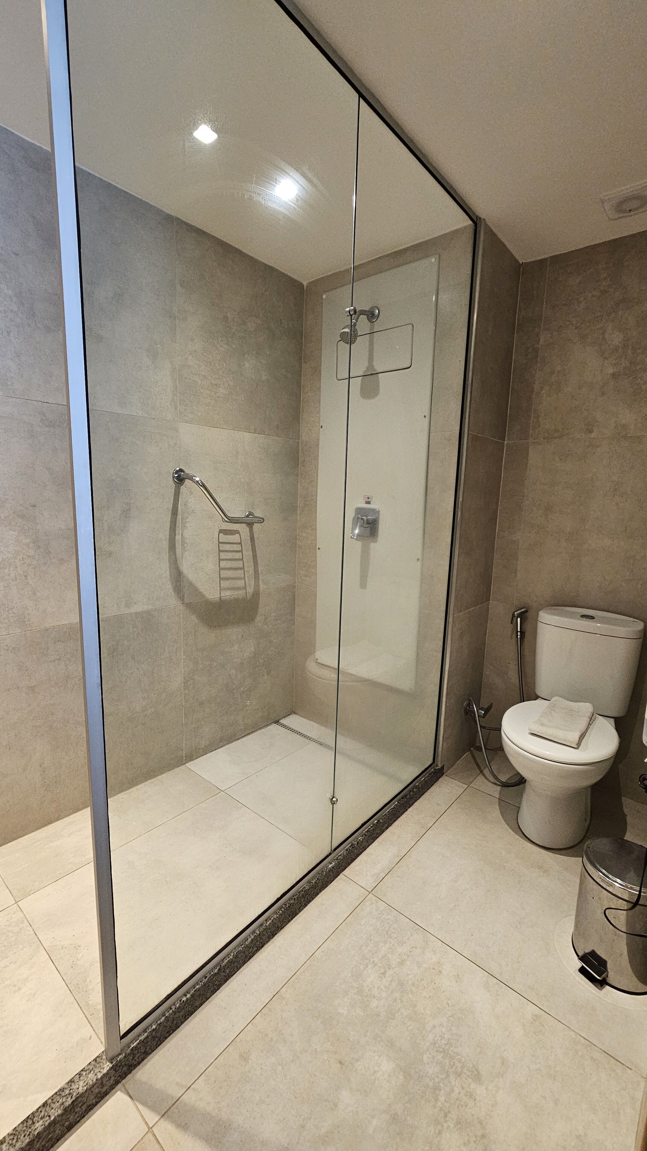 shower, designer toiletries, hair dryer, towels