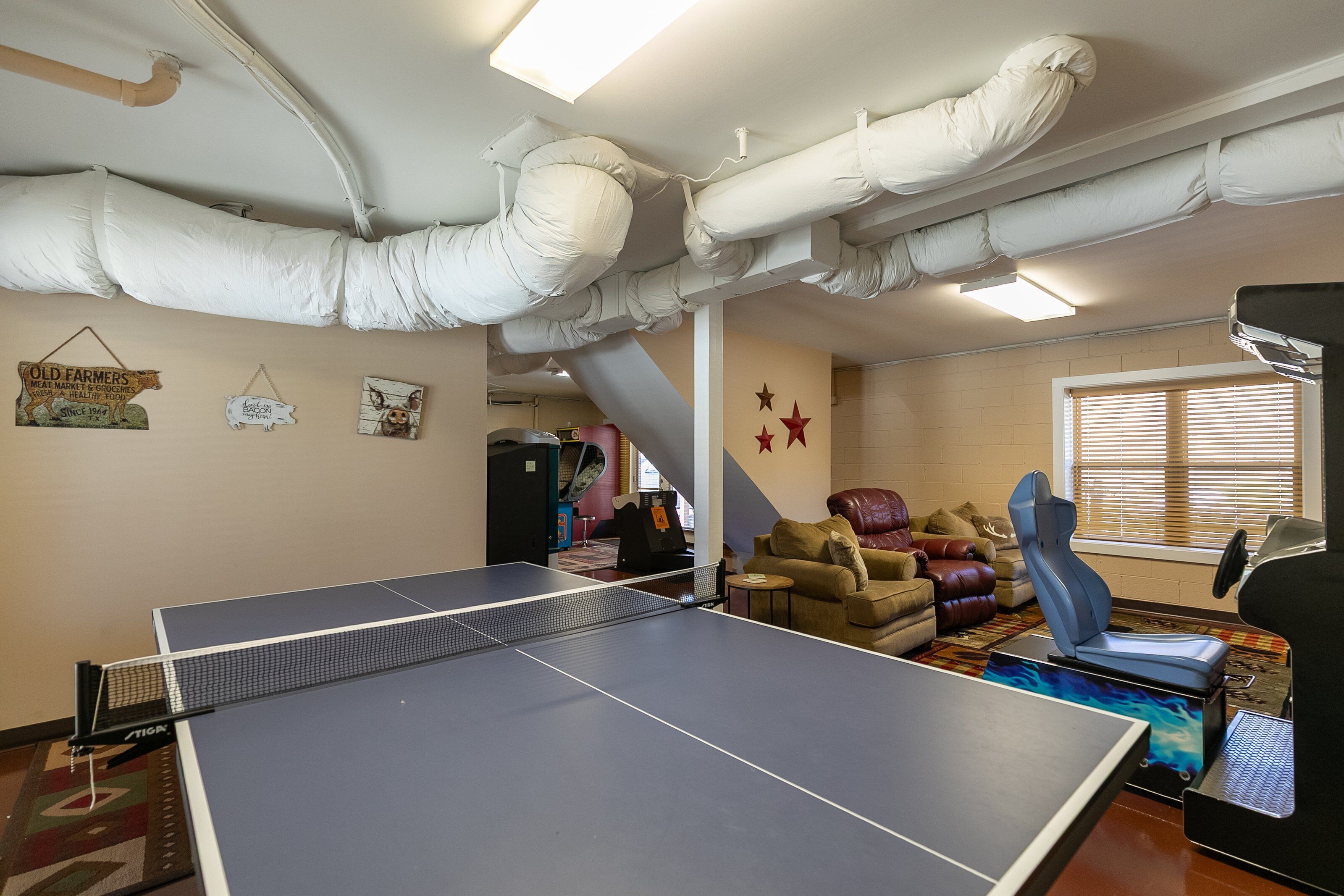 Game on! The basement rec room at New River Ramble keeps the fun going with ping pong, lounge seating, and arcade games.
