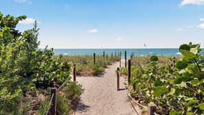 A sandy path leading to a beach with a clear view of the ocean. - Sunset Captiva 10 - Private home just steps to the beach (Captiva)