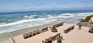 A seaside terrace with wooden seating and potted plants, overlooking the ocean. - REMODELED 3 BEDROOM 2.5 BA. HOME ACROSS FROM PRIVATE BEACH OR WALK TO DOG BEACH! (Solana Beach)