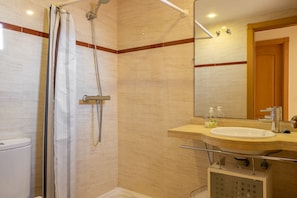 Bathtub, hair dryer, towels